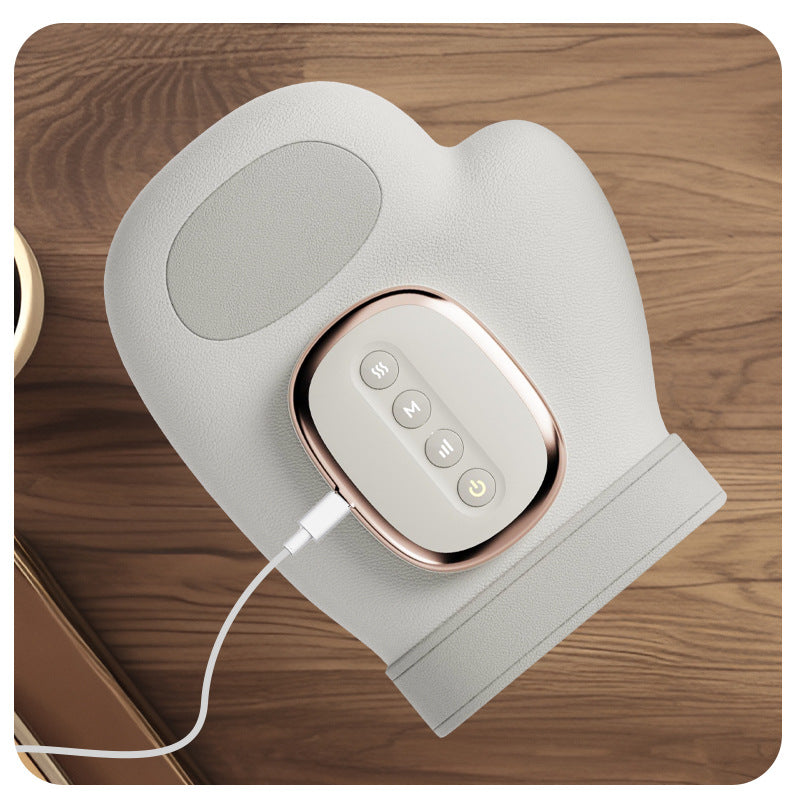 Cordless hand massager resting on a surface